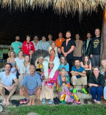 Retreat group with the visiting tribe in the maloca at night
