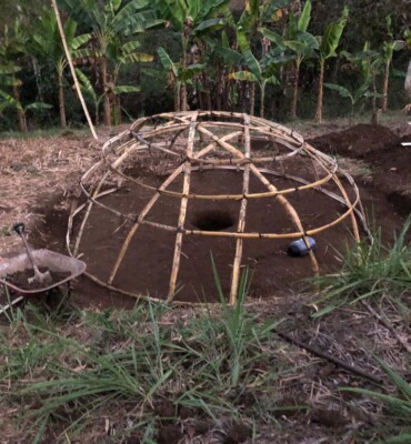 The temazcal frame being built from bamboo