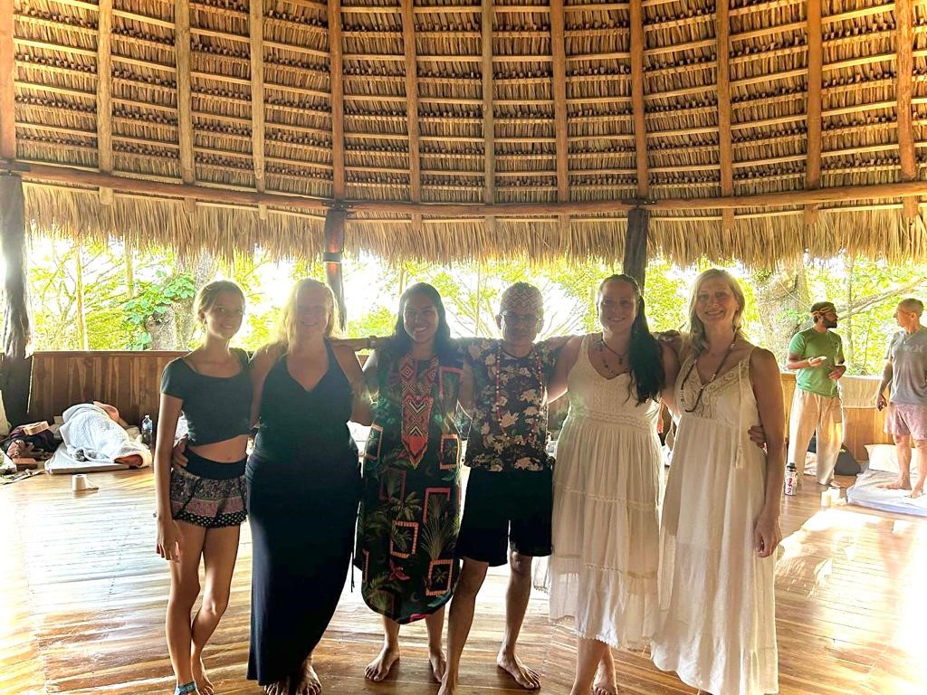 Retreat group standing together inside the maloca